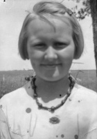 Girl, hand-beaded necklace.jpg