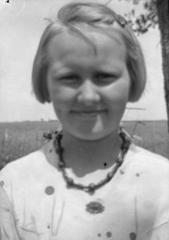 Girl, hand-beaded necklace.jpg