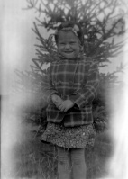 Girl-in-coat-pine-tree.jpg