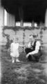 Antique-Shop-Negatives-1 -Man-And-Baby-In-Yard.jpg