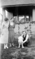 Antique-Shop-Negatives-1 -Two-Women-A-Man-And-Baby-In-Yard.jpg