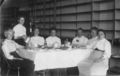 Ladies-having-tea-doughnut-on-a-fork-1900s.jpg