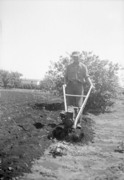 File:Antique-Shop-Negatives-2 -Man-Operating-Small-Roto-Tiller.jpg