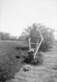 Antique-Shop-Negatives-2 -Man-Operating-Small-Roto-Tiller.jpg