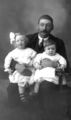 Father-and-Two-Daughters-1890s.jpg