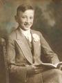 Seated-Boy-Reading-Book-Portrait-1900s-Hand-Colored-Black-And-White-Sepia-Photo.jpg